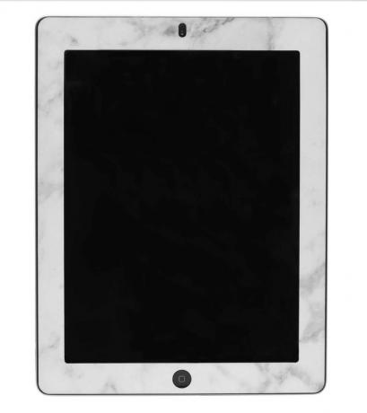 Mramorový vzhled rámující obrazovku iPadu.